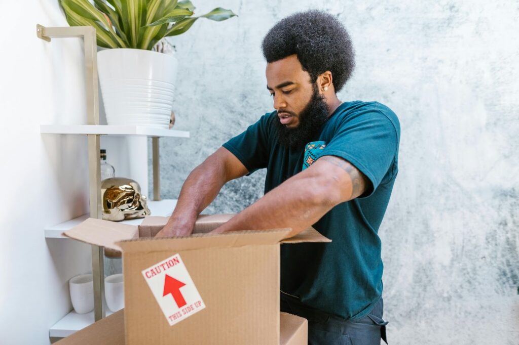 man moving photography equipment